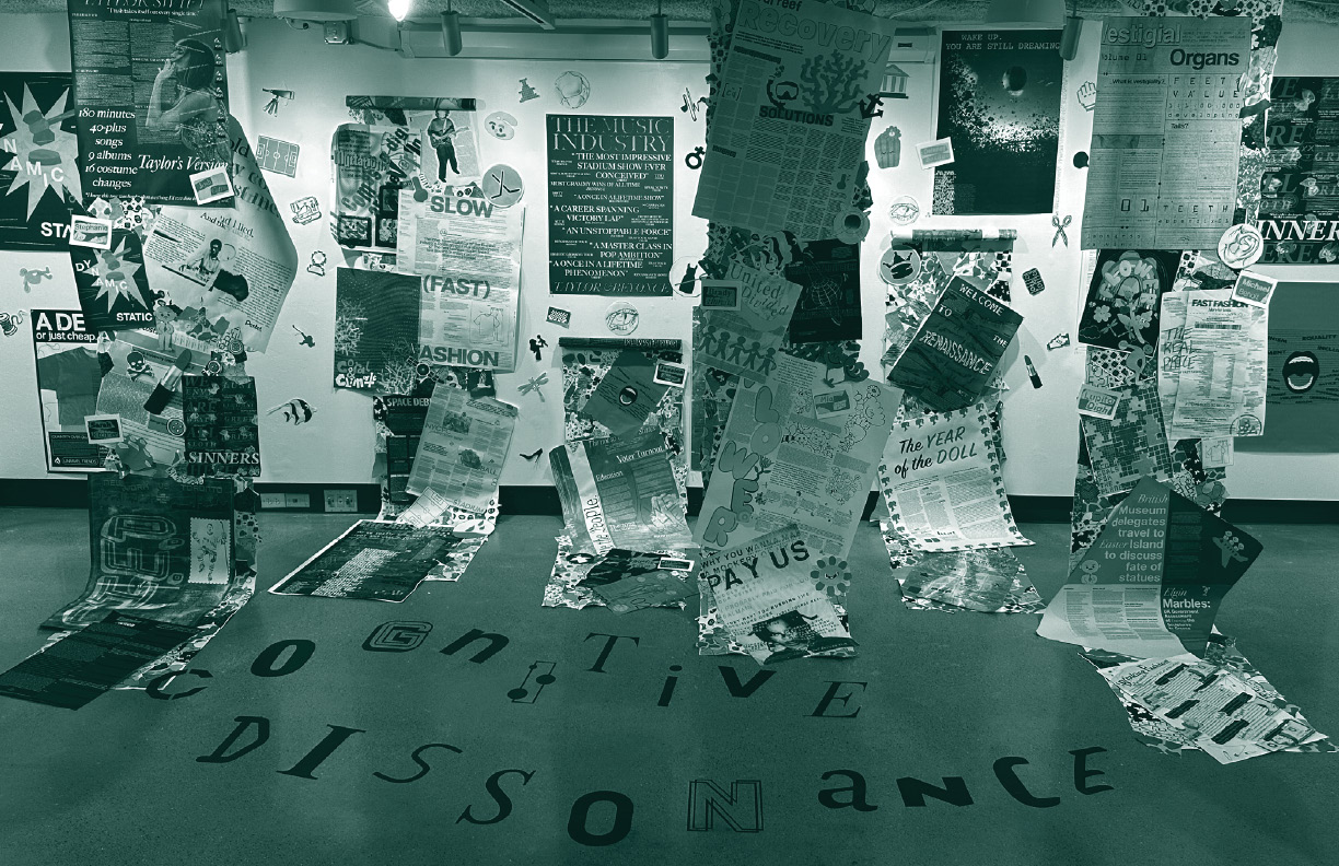 a gallery exhibition titled cognitive dissonance with a variety of posters hanging from the walls and ceiling